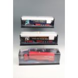 Three cased Corgi model trucks including Eddie Stobart and Parcelforce, 32 cm long