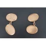 A pair of 1920s 9 ct gold cufflinks, having oval faces with finely reeded borders, 9 g