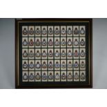 Framed cigarette cards depicting RAF squadron badges, 51 x 46 cm