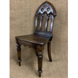 A reproduction Victorian Gothic oak hall chair