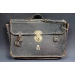 A George VI Government brief or despatch case, together with a tan leather briefcase.