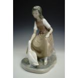 A Nao figurine girl with goose, 22 cm`