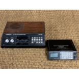 Two 1980s radio receivers, Yupiteru multi band receiver model MVT-8000, and Realistic 'UHF/VHF