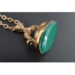 9 carat gold fob seal, with vacant chrysoprase matrix, 2 g, on a gold plated chain.