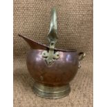 A Victorian brass and copper coal helmet