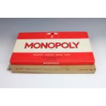 A new-old-stock 1970s Monopoly board game, in original cellophane-wrapping, un-opened