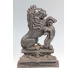 A Victorian cast iron door porter modelled as a heraldic lion, 36 cm