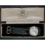 A 1930s 9 ct gold wristwatch, having a Swiss movement and circular white enamel face with Roman