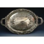 A Victorian two handled electroplate tea tray bearing a design registration lozenge, together with