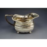 Art Deco silver milk jug, of rectangular form with gadrooned rim, double banded waist and standing