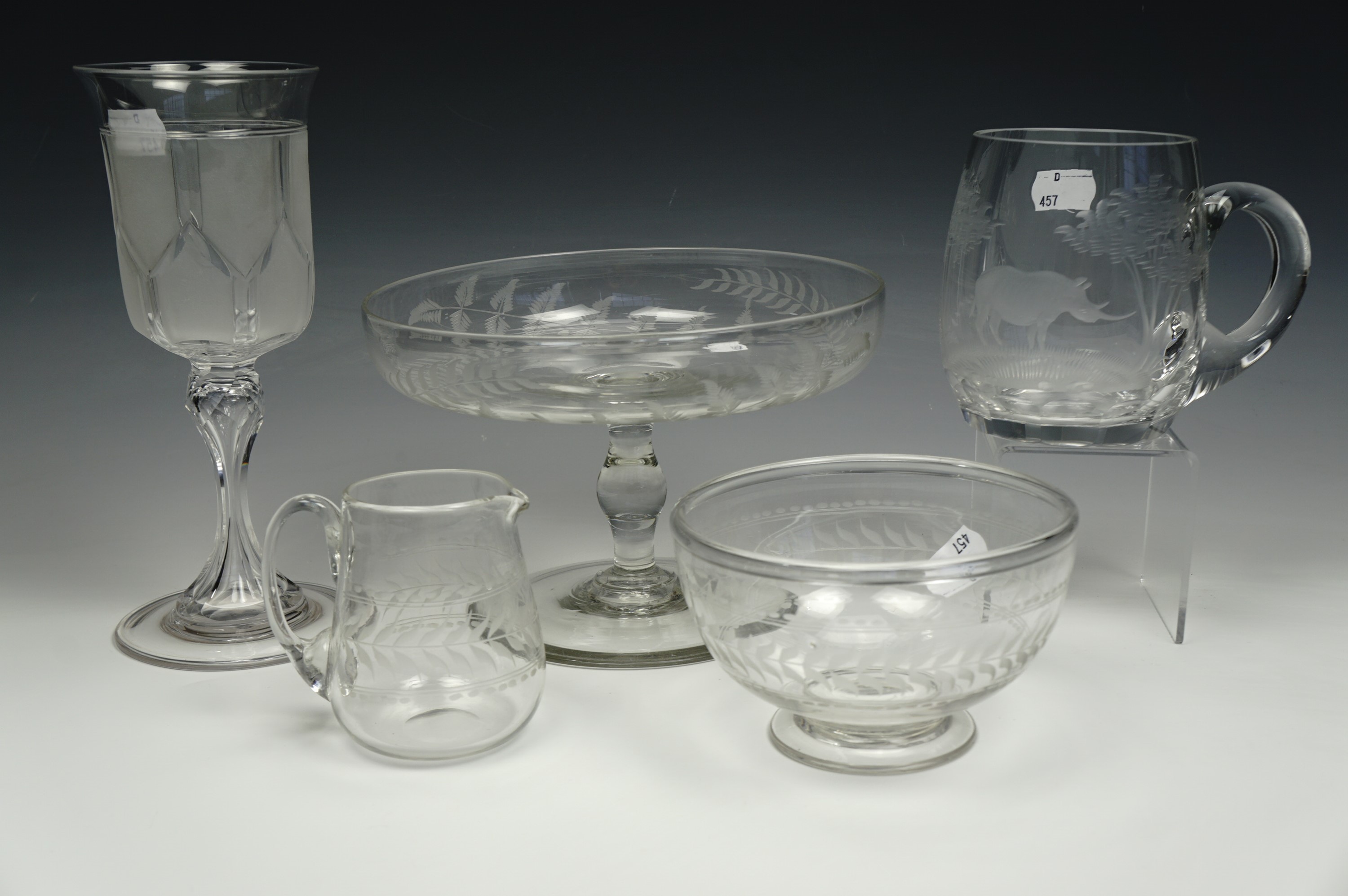 A Victorian glass sugar bowl and milk jug, together with a Victorian fern leaf decorated glass