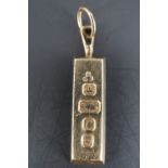 A 9 ct gold ingot pendant, 26 mm excluding suspender, 7.2 g