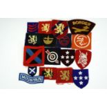 Sundry items of British army cloth insignia including printed Highland and 78th infantry division