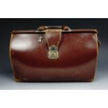 A late 20th century leather briefcase with key, 30 cm