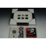 A David Bowie 2020 UK one ounce silver proof coin and framed David Bowie stamps together with