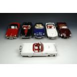 A group of die-cast sports cars