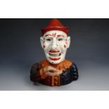 A die-cast novelty clown money box