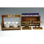 A wooden 'International Cigar Selection' shop display case together with a W.O. Larsen tobacco jar