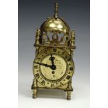 A Smiths 1950s brass mantle clock in the form of a miniature lantern clock, 17.5 cm high