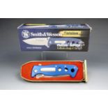 A Smith & Wesson "Cuttin Horse" collector's knife and tinplate box