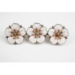 A vintage Aksel Holmsen enamelled white metal apple blossom brooch, stamped 925S Norme, 4.5 cm