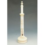 A 19th Century turned and carved ivory desk thermometer, of columnar form, having Fahrenheit and