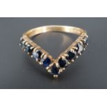 A sapphire wishbone ring, the stones set on a 9 ct gold shank, Q, 2.5 g