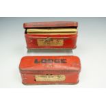 A pair of vintage Lodge car spark plugs in original tinplate boxes