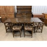 An Ercol Old Colonial dining suite, including sideboard / dresser