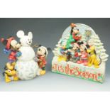 Two boxed Enesco 'Walt Disney Collection' pieces, 'Magic Comes in Many Shapes' and 'T'is the Season'