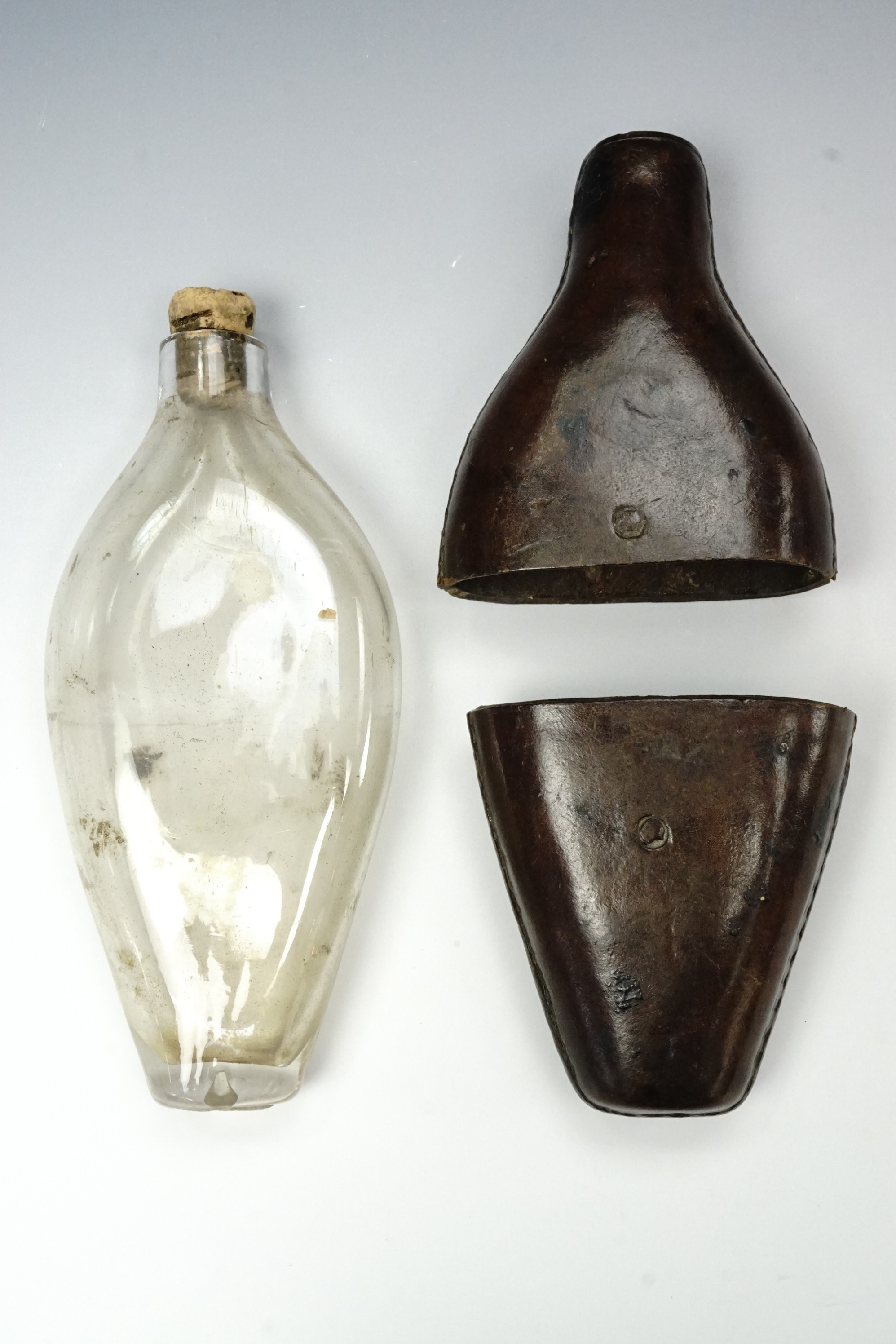 A Victorian leather-covered glass hip flask, 15 cm