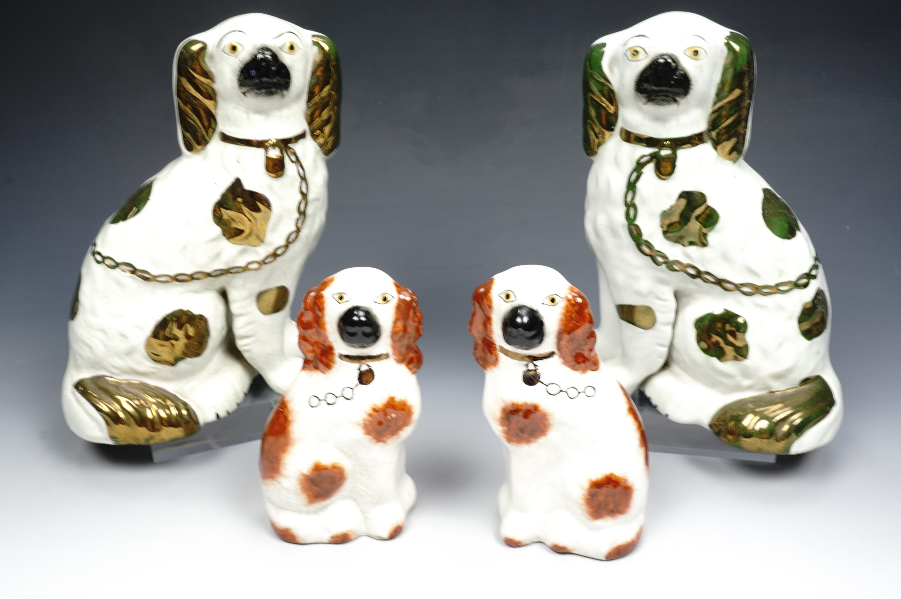 Pair of Victorian fireside spaniels and a smaller late 20th century pair, larger pair 21.5 cm high.