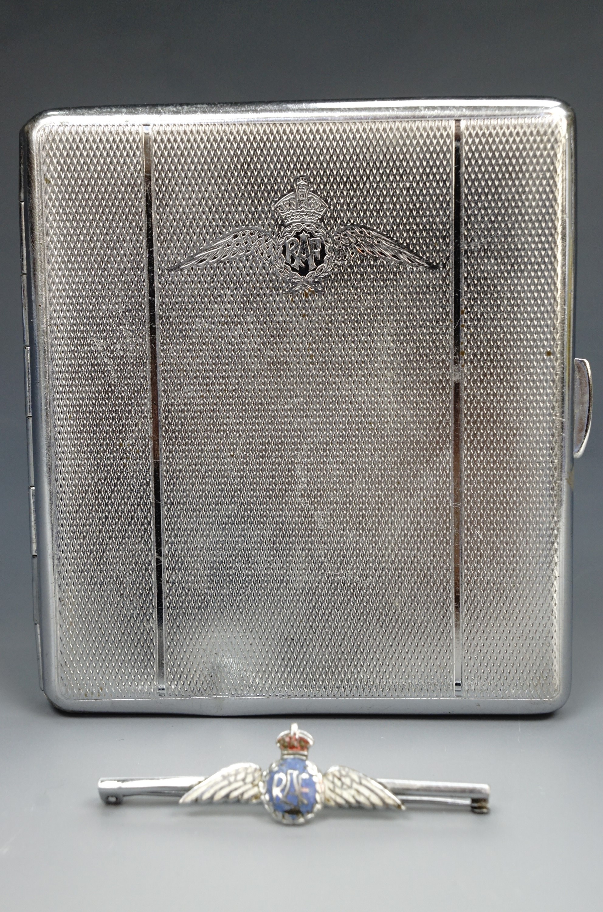 A chrome plated RAF cigarette case, together with an enamelled RAF sweetheart brooch