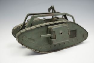A fine Great War period hand-made brass model / toy British Mk I "male" tank, green painted, given