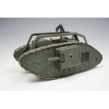 A fine Great War period hand-made brass model / toy British Mk I "male" tank, green painted, given