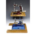 Two toy sewing machines