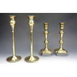 Two pairs of brass candlesticks, 24 cm and 31.5 cm