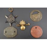A pair of Second World War British army identity discs together with a campaign medal, French