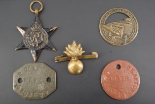 A pair of Second World War British army identity discs together with a campaign medal, French