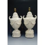 A pair of creamware style table lamps, 46 cm