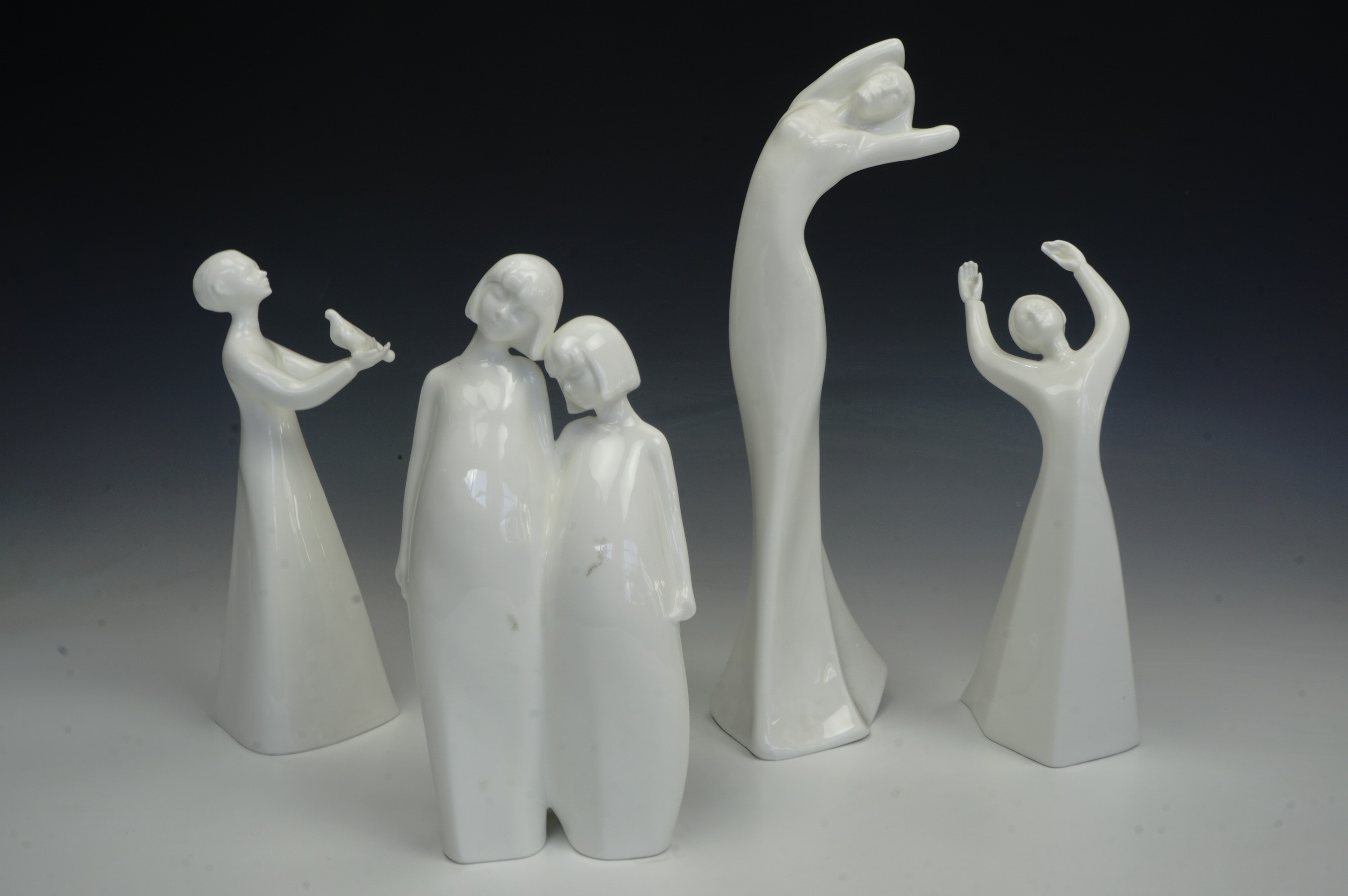 Four Royal Doulton figurines; 'Yearning', 'Sisters', 'Awakening' and 'Peace', tallest 29 cm