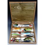 Cased fishing lures, as new, approximately thirty one