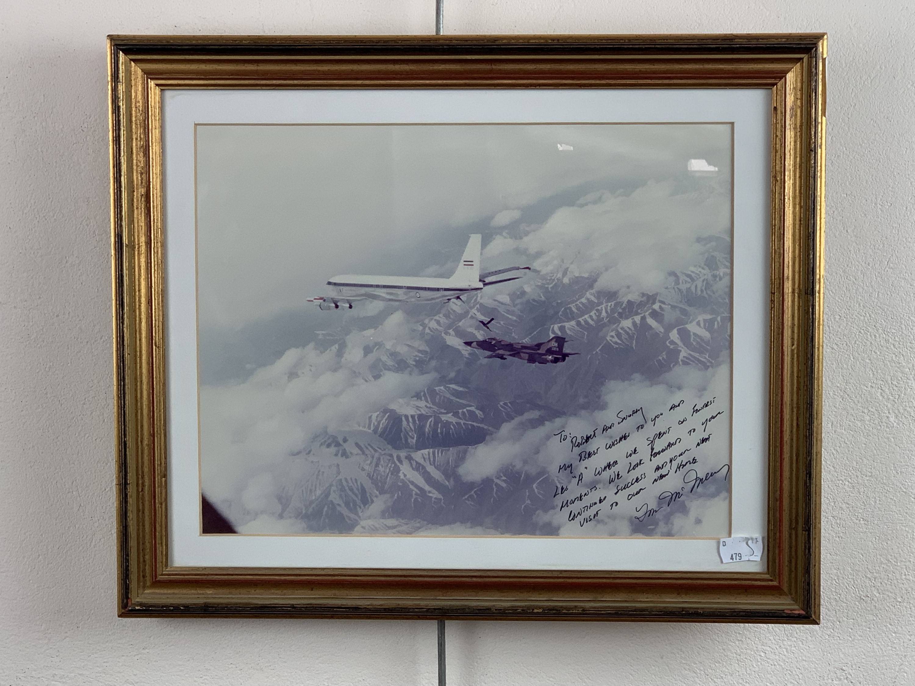 A framed photograph of a US Air Force F-111 Aardvark jet aircraft flying out of RAF Upper Heyford,