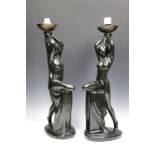 A pair of Art Nouveau influenced black glazed ceramic figural table lamps, 52 cm