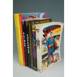 A quantity of comic book compilations including Bat Man and Super Man