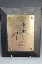 A brass plaque bearing a portrait of Field Marshal Sir John French, mounted on a bevel-edged