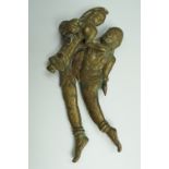 An Indian or Ceylonese brass and iron betel nut cutter, modelled in the form of a embracing figures,