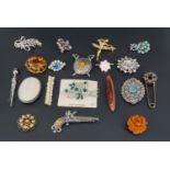 A group of vintage romantic Scottish and other costume jewellery including brooches modelled