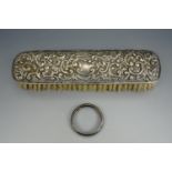 Embossed silver backed clothes brush, Birmingham, 1912, and a plain silver napkin ring,