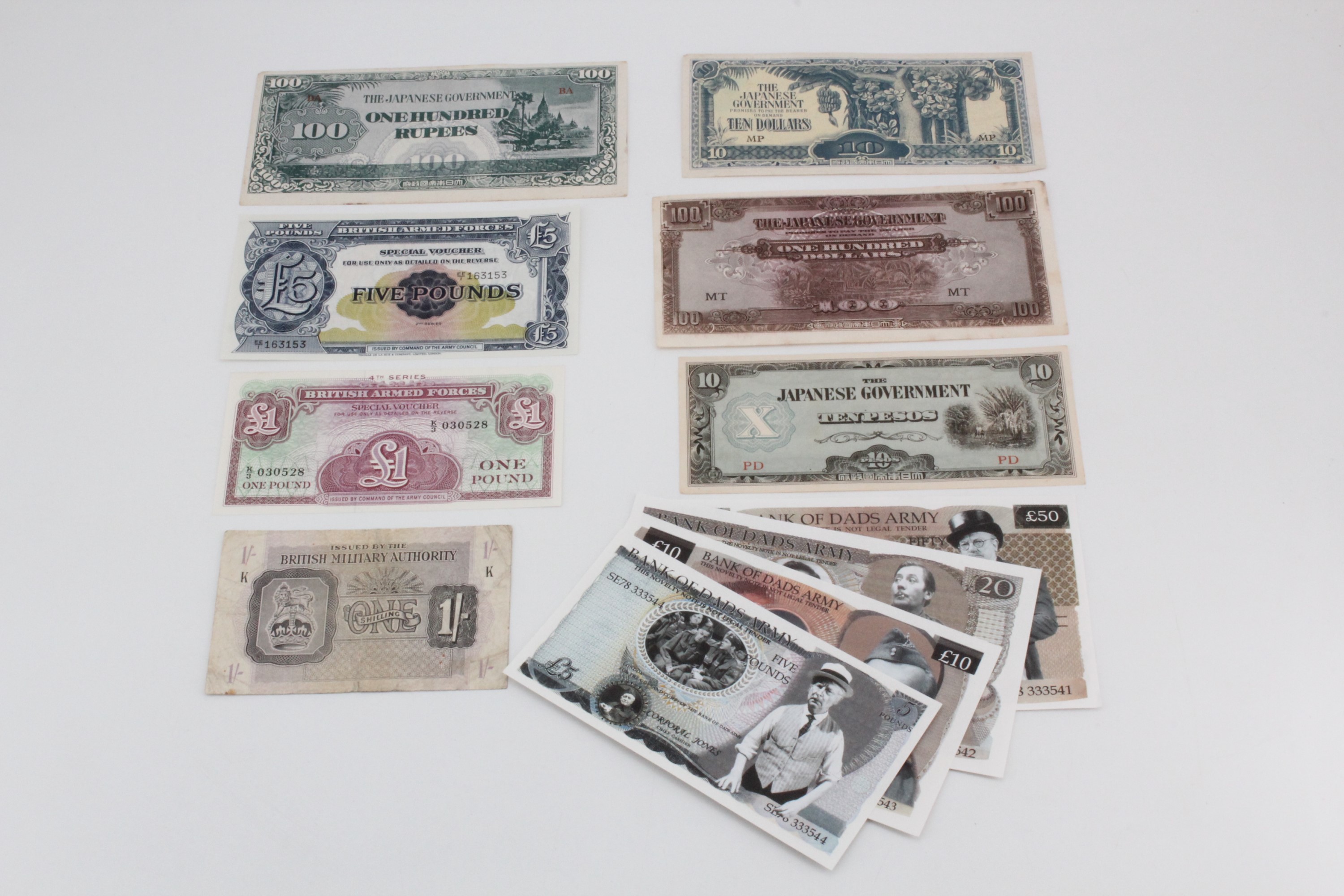 A group of British military and Second World War Japanese occupation banknotes together with